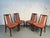 Elegant set of four mid-century modern dining chairs by G Plan Furniture. Expertly crafted with sleek lines and warm wood...