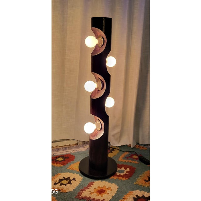 A monumental 1970s California Organic Modern statement piece: the carved sculptural "Totem" cylinder floor lamp by...