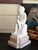 Early 20th century Italian porcelain bisque statue figurine of a "Putto Writing" after Canova. This piece is a classic...