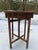 A single square shape wood side or drinks table featuring a folding four leg base and removable top covered in birch bark...