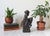 Vintage hand-carved wooden folk art sculpture depicting a figure wearing turban-like head covering while riding a donkey....