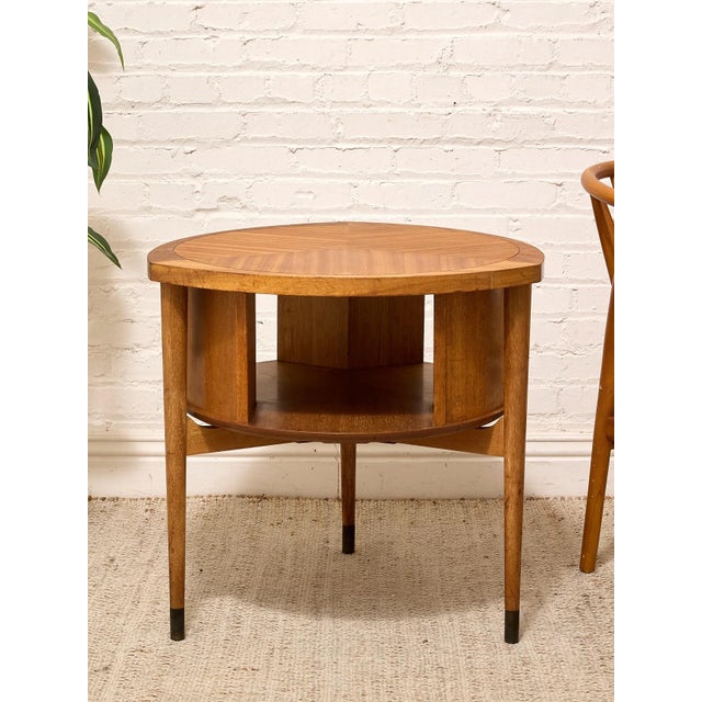 A beautifully crafted vintage round side table by Brown Saltman, showcasing the sophisticated woodworking and clean...