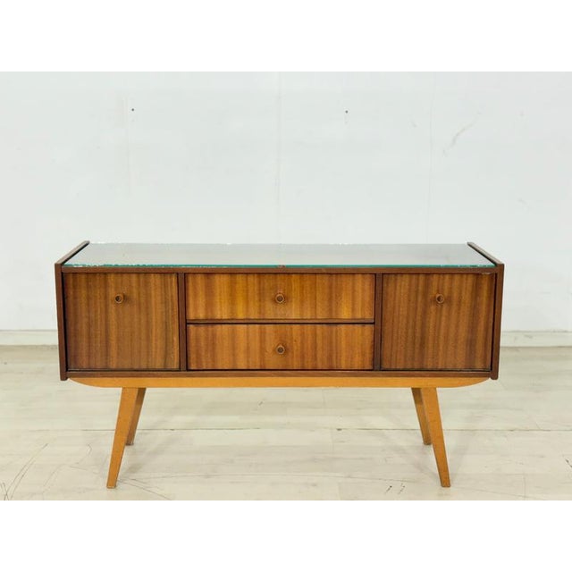 For sale is a charming vintage chest of drawers from the 1960s. This piece of furniture impresses with its clean lines,...