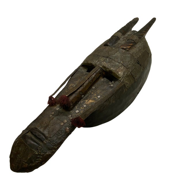 Striking vintage ceremonial-style mask from Mali, hand-carved from wood and extensively embellished with hand-worked metal...