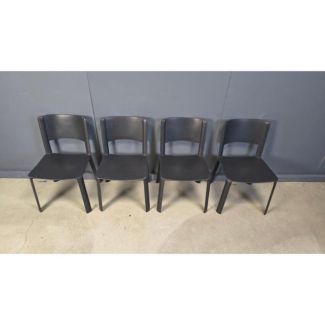Vintage black leather dining chairs made in italy. Good overall condition 1980s - Italy Dimensions: Height: 80cm Width:...