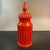 Mid-century, Italian, Moorish art pottery jar with lid in vibrant paprika red-orange. This glazed ceramic piece features a...