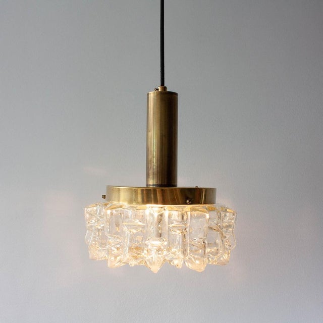 Bring authentic mid-century charm to your space with this vintage German pendant lamp from the 1960s. Featuring a thick,...