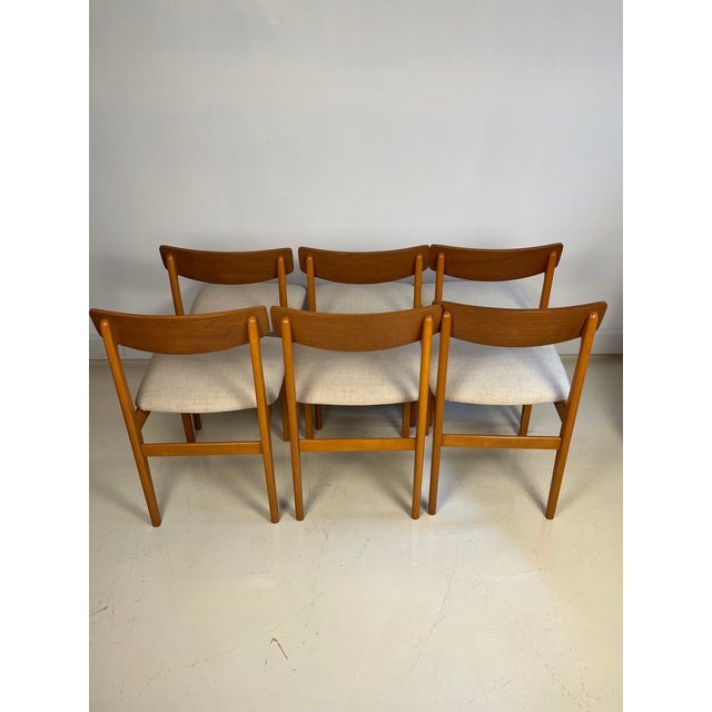 6 wooden Danish dining chairs. Simple line, new upholstery