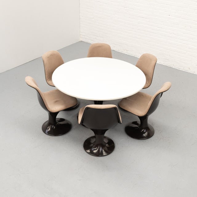 This rare space age dining set from the 1960s consists of a round dining table and six matching chairs, designed by markus...