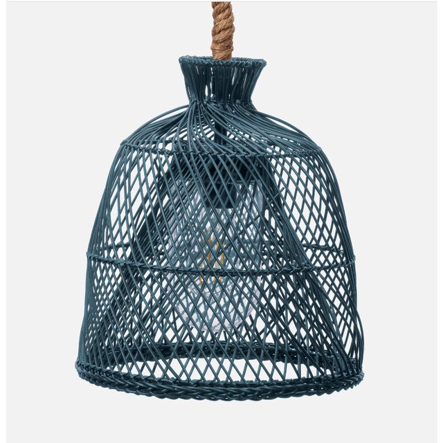 Faux straw rattan delivers an irresistible centerpiece to any space with the dreamy Dayton pendant. Two shades layered...