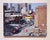This oil painting captures a vibrant urban scene, where the interplay of light and shadow brings the city to life. A...