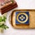 A small vintage Italian Florentine catchall featuring a saturated cobalt-blue finish, raised gilt detailing, and a central...