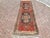 This gorgeous hand knotted vintage Anatolian runner rug is approximately 70 years old in excellent vintage condition. The...