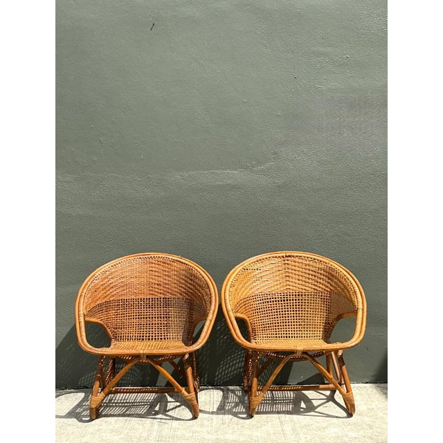 Exemplifying mid-century modern organic design, this pair of vintage lounge chairs showcases sculpted, curved silhouettes...