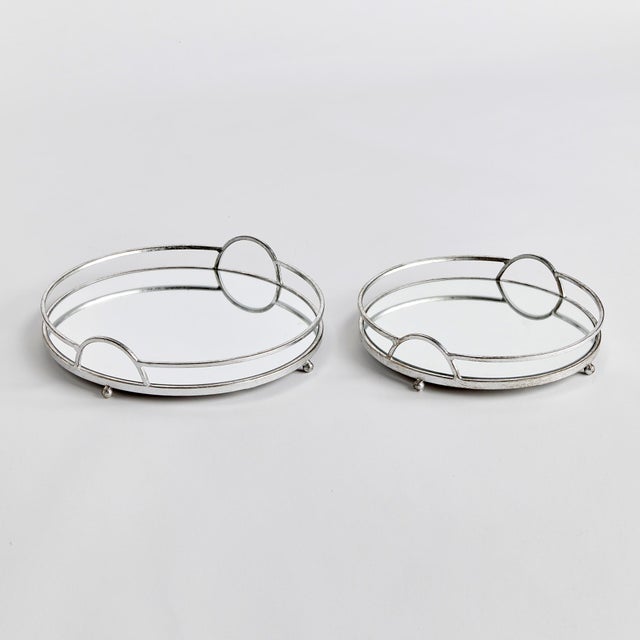 These round mirrored trays are an unexpected combination of antique silver and glass. A classic look with a modern twist....
