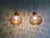 Pair of brass and smoked blown glass pendant lights, produced by the german manufacturer glashütte limburg in the 1970s....