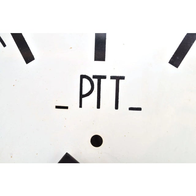Beautiful PTT wall clock with a flat glass panel, 1960. The clock has been converted to a quartz movement (battery-...