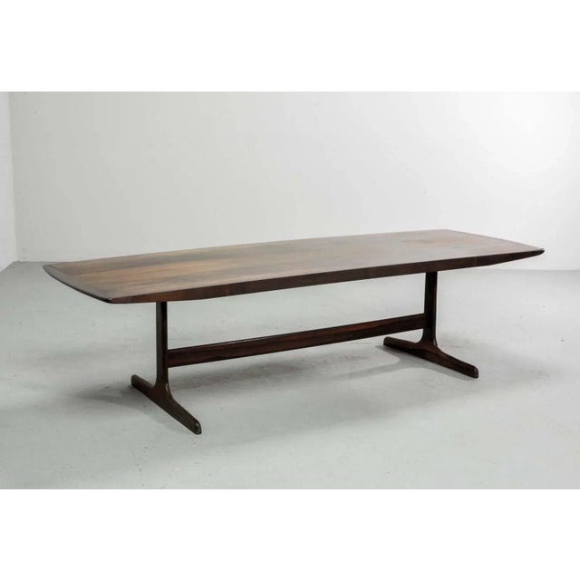 This Dutch coffee table was designed by the cabinet maker Fristho for Topform, The table has solid rosewood legs and the...