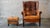 1970s Vintage Art Deco Distressed Cognac Leather Wingback Chair & Ottoman For Sale - Image 4 of 16