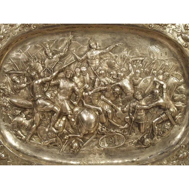 This richly decorated silver serving tray with repousse work is from Germany’s Gründerzeit period, circa 1850. The...