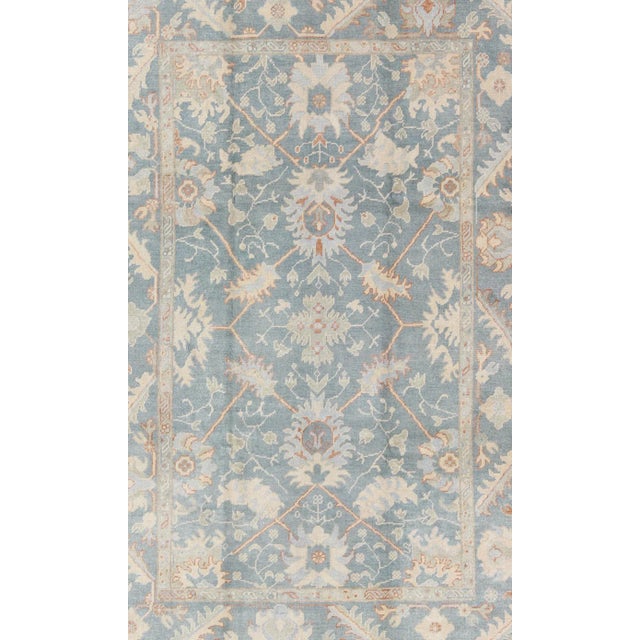 Tribal Turkish Oushak Rug With Floral Design in Light Steel Blue and Coral Accent For Sale - Image 3 of 12