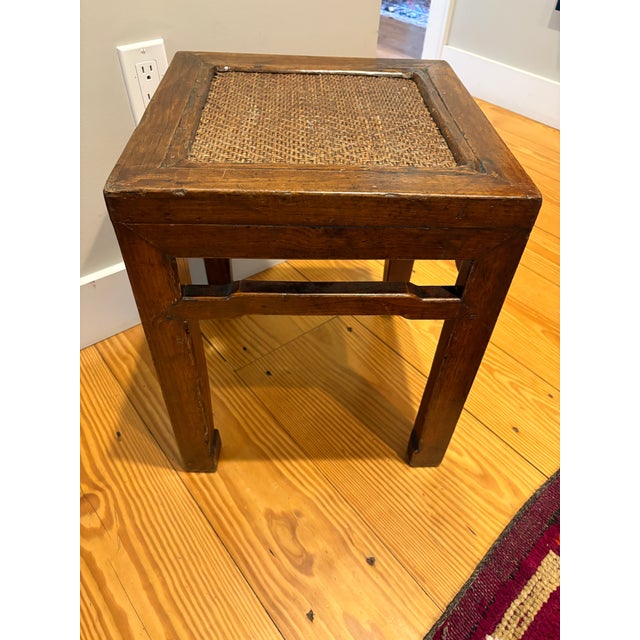 Exquisite antique Chinese side table from the Ming Dynasty period. Exceptional condition in elmwood with a fine patina and...