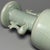 This elegant vase is crafted in classic Longquan celadon style, originating from China. It features graceful twin phoenix-...