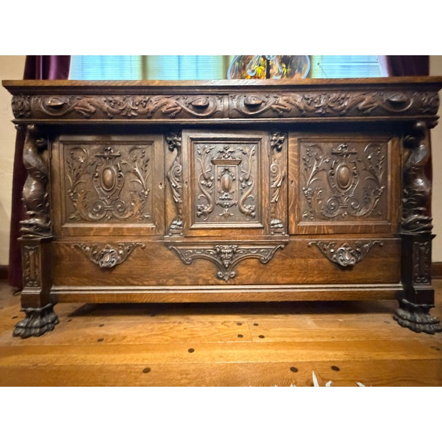 This Late 19th Century English Renaissance Gothic Oak Buffe Sideboard is a refined expression one of the oldest English...