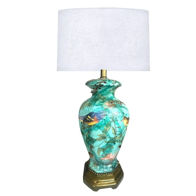 Bring a vibrant pop of designer character to your interior with this exquisite Chinoiserie bird and botanical table lamp....