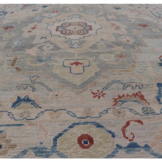 Measures: 8'5 x 11'9 Modern Oushak Turkish Rug with All Over Design in Light Blue, Ivory, & Red. Keivan Woven Arts / rug...
