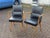 Mid Century Pair Of Library Armchairs Finished in a faux black leather. The chairs are strong and solid, the foam in the...