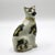 An authentic 19th-century English Staffordshire ceramic cat figure seated upright with an alert expression and charmingly...