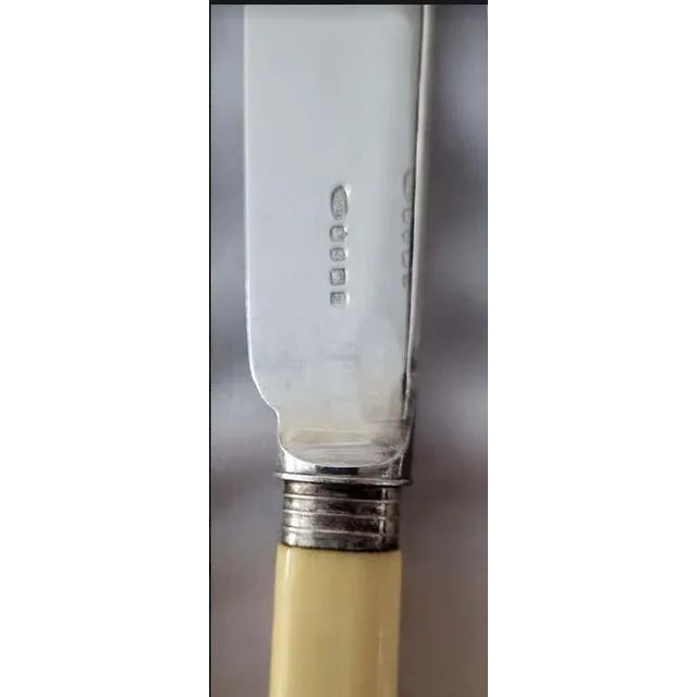 Set of 8 Art Deco fish knives & forks for 4 persons. The handles appear to be bakelite and the silver plate features...