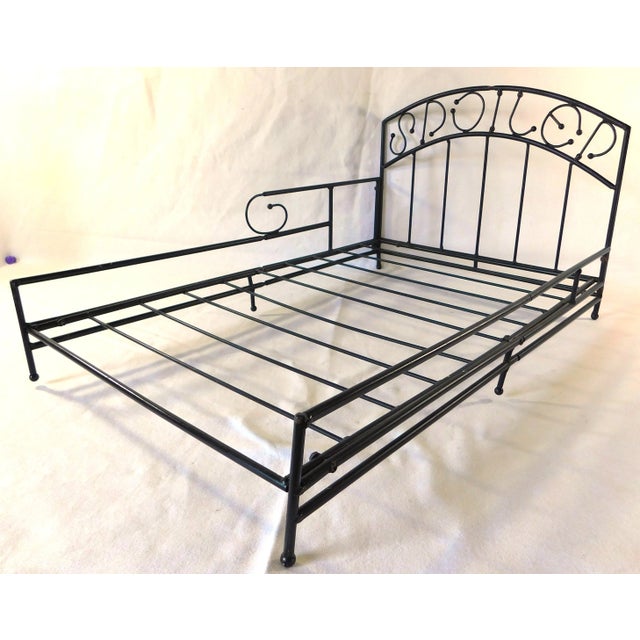 Sweet black metal "Spoiled " dog bed frame. Solid and Sturdy. A MUST have!! Comes apart for easy and reasonable shipping....