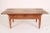 Antique Directoire style fruit wood coffee table, 19th century. With an overhanging 3 board top, 3 frieze drawers with...