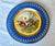 An exquisite and finely detailed antique Royal Vienna porcelain cabinet plate, beautifully hand-painted by the highly...