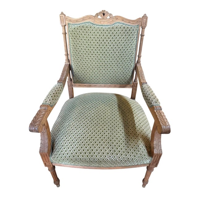 Beautiful pair of antique Louis XV arm chairs. They feature limed oak, neoclassical carvings, carved acanthus leaf...