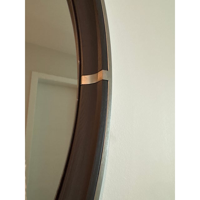 Gorgeous large round wood mirror with metal accents.