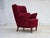 1960s, Danish armchair. Original red furniture fabric, beech wood legs with brass plugs, brass springs in the seat....