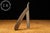 Large-scale figural barber trade sign fashioned in the form of an oversized folding straight razor. Constructed with a...