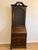 A beautifully proportioned antique solid mahogany secretary desk with glass-front upper cabinet and elegant carved...