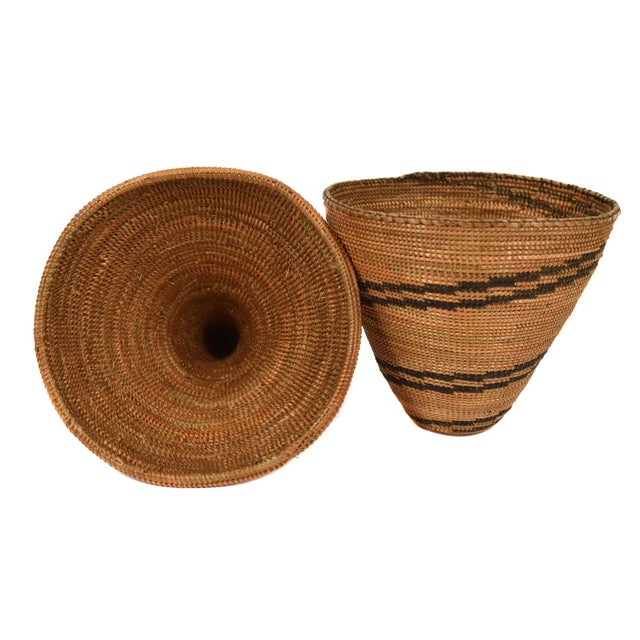 The Tutsi Tight Weave Basket with Lid from Rwanda epitomizes the artistry and tradition of the Tutsi community's weaving...