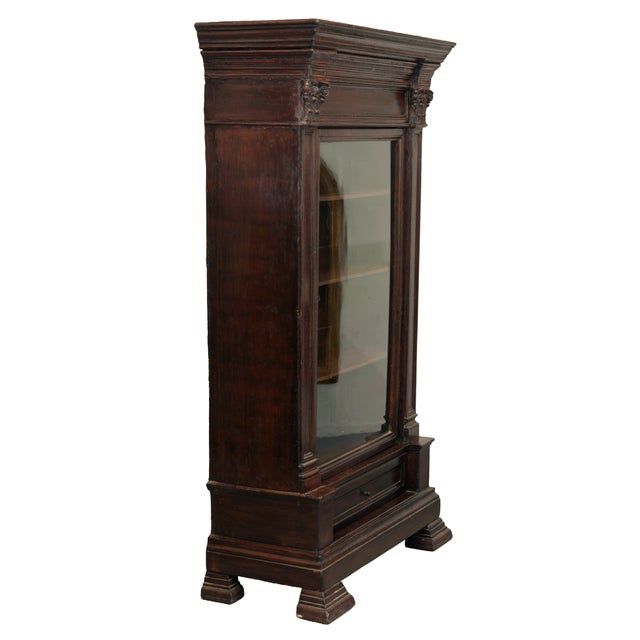 An unusual antique wooden display cabinet dating from the late 18th to the first half of the 19th century, distinguished...