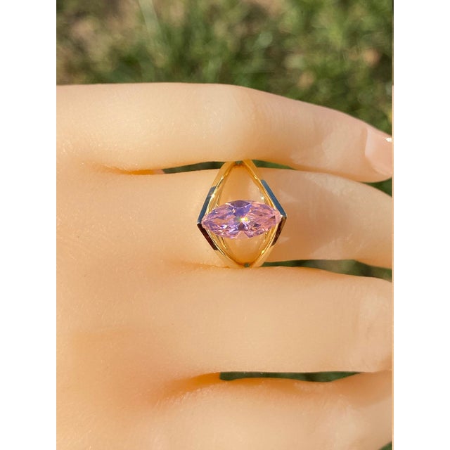 The Kilbourn Ladies Yellow Gold Cocktail Ring set with Pink Cubic Zirconia. Crafted in polished yellow gold, this ladies...