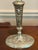 Elegant pair of vintage silverplate candlesticks featuring classical ram’s head medallions, ribbon-and-garland decoration,...