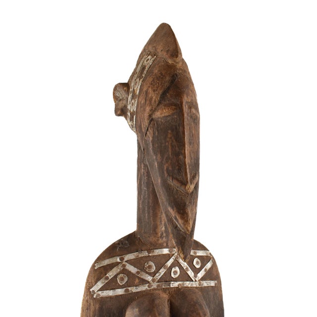 This is a wonderful example of a female figure with a beautiful body in the finest Senufo tradition. The angular jaw and...