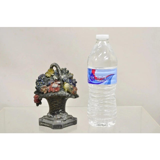 Antique Victorian Cast Iron Small Painted Floral Bouquet Basket Door Stop. Circa Early 20th Century. Measurements: 5.5" H...