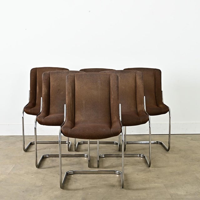 French midcentury (circa 1970) set of six dining chairs using cantilevered seats on chrome frames, in the manner of...
