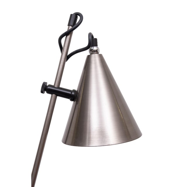 Beautiful Floor lamp. Works on a heavy-use ball joint Can move Left to Right and Back to Front and stays in the position...