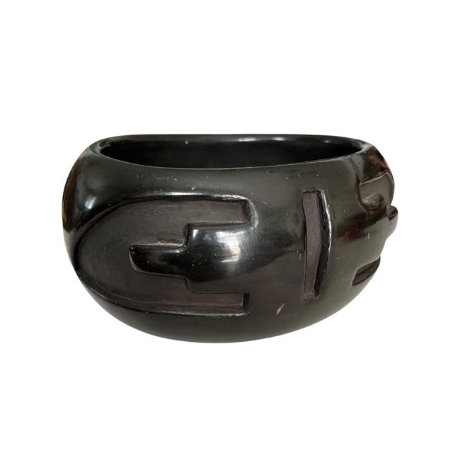 Excellent example of hand-coiled blackware pottery bowl signed by Santa Clara Pueblo artist Stella Chavarria. This piece...